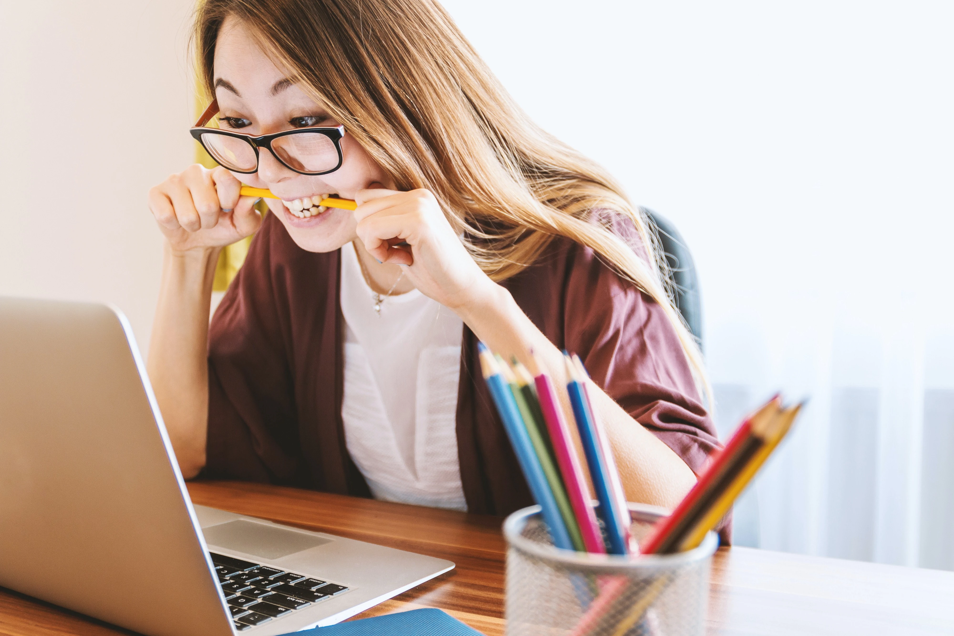 Image showing a person biting a pen